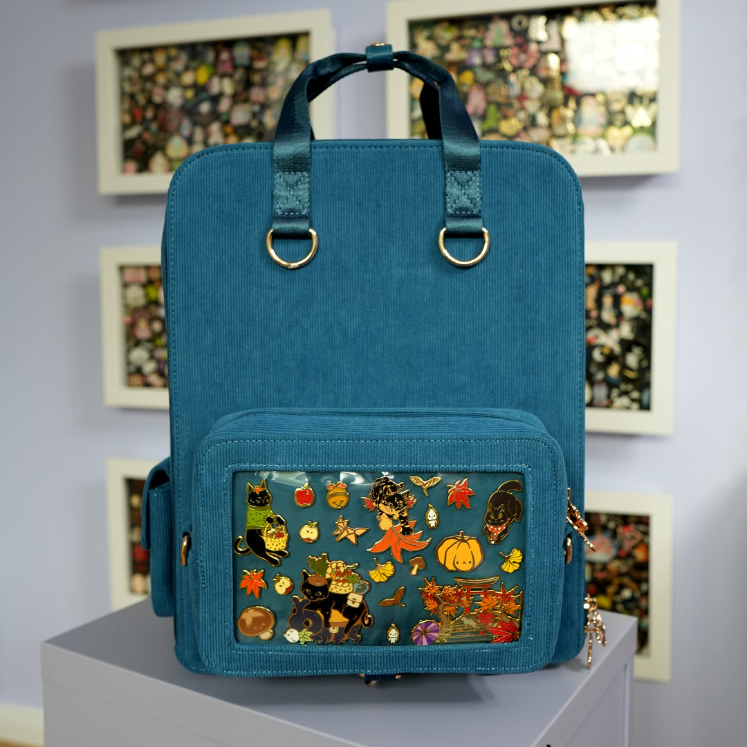katzenjammerpins-ita-bag-rucksack-petrol-fronttasche-gold image 2